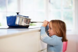A child getting a saucer pan